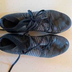 Black and white soccer cleats